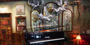 A piano in the Walled Off Hotel (owned by Bansky) near the wall of separation in Bethlehem. 