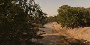 The Darling River near Louth in far western NSW was dry in January last year. Recent heavy falls are sending the first flows down the river after years of drought. 