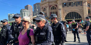 Dozens arrested as climate protesters bring CBD traffic to a standstill