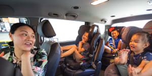 May Ng and her children,Zara,5,Solomon,8,and Layla,2,are keen to use Uber’s car seats.