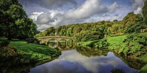 Bridge over the main lake in Stourhead Gardens,England.