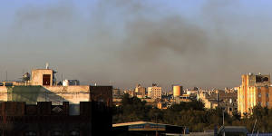 Smoke rises from the area around the international airport in Sanaa after the strikes.