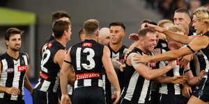 Collingwood celebrates Tom Mitchell’s goal.