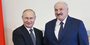 Russian President Vladimir Putin,left,and Belarusian President Alexander Lukashenko pose for a photo during their meeting in St Petersburg,Russia in July,2021.