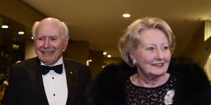 John and Janette Howard arrive at the club for his 80th birthday party on July 26.