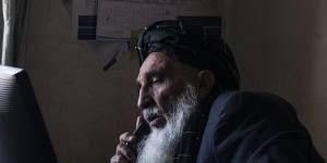 The Afghan Independent Human Rights Commission’s (AIHRC) Uruzgan office was opened by Haji Abdul Ahad Bahai,pictured working in his office,who is from Uruzgan and known locally as The Chancellor.