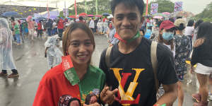 Michelle Jane Talaboc with Mike Joy Leonar,both 20,turn out to see Marcos in Mindinao.