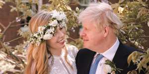 Boris Johnson with his wife,Carrie Johnson (nee Symonds),at their wedding earlier this year. 