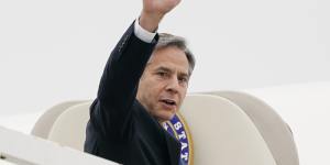 US Secretary of State Antony Blinken waves as he departs Andrews Air Force Base. 