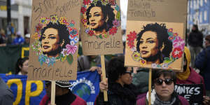 People carry posters with images of slain Brazilian councilwoman Marielle Franco during a demonstration against racism in Lisbon,Portugal,last month.
