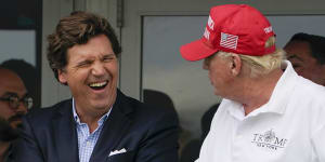 Tucker Carlson (left) and former US president Donald Trump,whom he hates,according to recently released documents.
