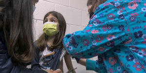 Alejandra Gerardo,nine,gets the first of two Pfizer vaccinations during a clinical trial for children in North Carolina,United States.