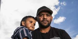 Leon Davis with his one-year-old son Wirin. He wants future generations to not have to suffer from racism.