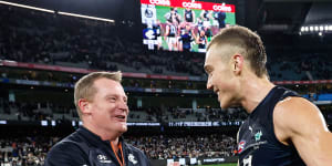 Patrick Cripps celebrates with Michael Voss after the win
