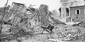A soldier picks through the ruins of Chipilly village,France,on August 10,1918,the day after the Chipilly Six had cleared the Spur.
