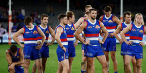 The Western Bulldogs look dejected after a loss during the round 5 match against the Essendon Bombers.