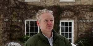 WikiLeaks founder Julian Assange walks across the lawn at Ellingham Hall in Norfolk in 2010.