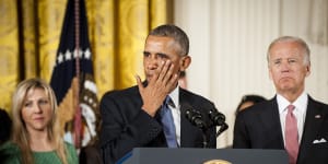 Then-US vice president Joe Biden looks on as then-US president Barack Obama wipes away a tear during remarks on gun control in 2016.