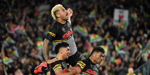 Penrith players celebrate during Saturday night’s victory.