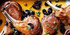 Roast lamb with olive,anchovy and caper sauce.