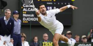 Novak Djokovic returns the ball to Carlos Alcaraz during the men’s singles final at Wimbledon.