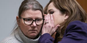 Jennifer Crumbley,left,listens to her attorney,Shannon Smith,during her trial.