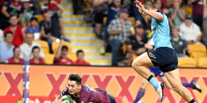 Jock Campbell,seen scoring for the Reds,says his priority would be helping Queensland overcome a run of quarter-final defeats in Super Rugby before considering his international career