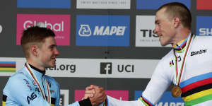 Rohan Dennis,right,with teen silver medalist Remco Evenepoel at the 2019 time trial world titles.