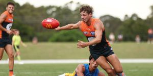 Harry Perryman gets the ball away for the Giants against the Suns.