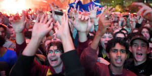 Melburnians celebrate in Federation Square on Thursday morning.