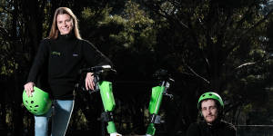 Lime’s Ellen Black and Mark Brodie with rental e-scooters at Lizard Log,one of four locations selected for the NSW government’s e-scooter trial beginning this Saturday.