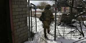 A Ukrainian soldier,Tanya,who does not want to be identified,walks back to her barracks at Avdiyivka. 