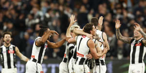 The Magpies celebrate after the final siren in their last-gasp win over Carlton.