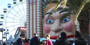 'A cavalier attitude':guests queue to enter Sydney's Luna Park last week.