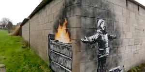 Banksy mural on garage in Wales sells for six-figure sum