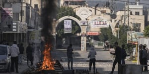 Palestinians clash with Israeli forces following an army raid in the West Bank city of Jenin on Thursday.