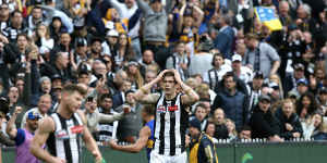 Sinking feeling:Magpies Taylor Adams and Mason Cox react after Luke Sheed kicks the winning goal for West Coast in the grand final in 2018.