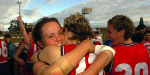 A young Daisy Pearce celebrates premiership success with her Darebin teammates in 2006.