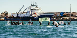A group of environmental activists paddle out into Corio Bay to protest a seismic testing ship en route to Otway Basin off King Island.