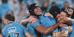 NSW players celebrate James Tedesco’s match-winning try.