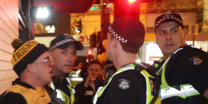 Police bitten,headbutted after dozens ejected from the AFL grand final