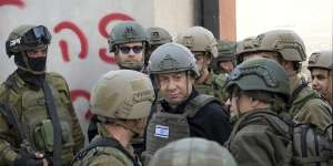 Israeli Prime Minister Benjamin Netanyahu receives a security briefing in the northern Gaza Strip on December 25.