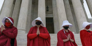 Activists opposed to Judge Barrett are dressed as characters from'The Handmaid's Tale'.