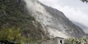 A cloud of dirt follows a mudslide a day after a powerful earthquake struck,in Hualien City,eastern Taiwan.