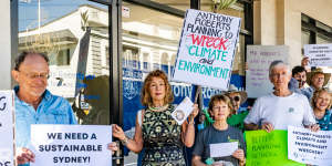 Protesters outside the electorate office of Planning Minister Anthony Roberts.
