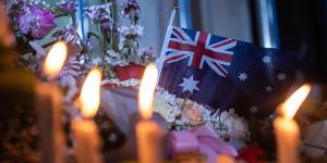 An Australian flag is seen during the commemoration in Bali.