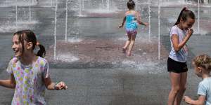 Children bathe in a reopened fountain on June 13,2022 in Irpin,Ukraine.