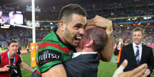Greg Inglis and Michael Maguire share a moment after South Sydney’s 2014 grand final triumph.