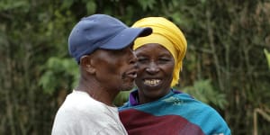 Genocide survivor Laurencia Mukalemera,a Tutsi,greets Tasian Nkundiye,a Hutu who murdered her husband and spent eight years in prison for the killing and other crimes,at Nkundiye's home in the reconciliation village of Mbyo,near Nyamata,in Rwanda. 
