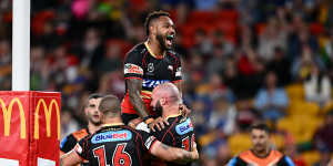 Hamiso Tabuai-Fidow celebrates the Mark Nicholls try for the Dolphins against Wests Tigers in Magic Round.